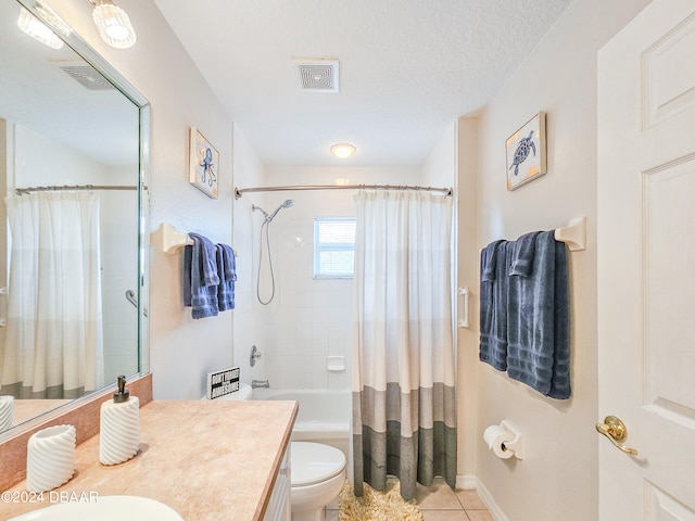 full bathroom with tile patterned floors, vanity, a textured ceiling, toilet, and shower / bathtub combination with curtain