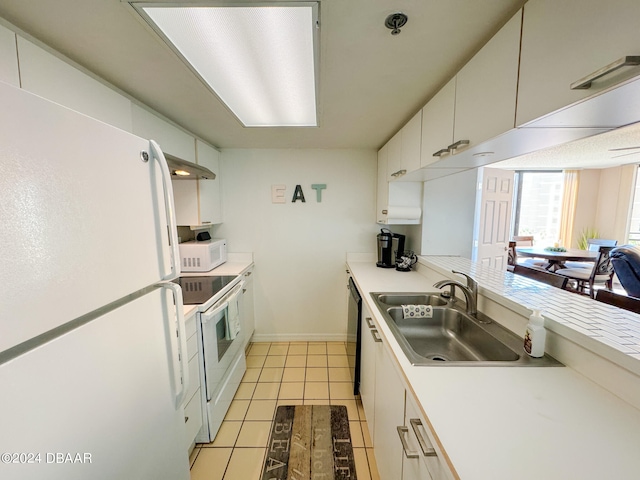 kitchen with white cabinetry, sink, white appliances, and light tile patterned floors