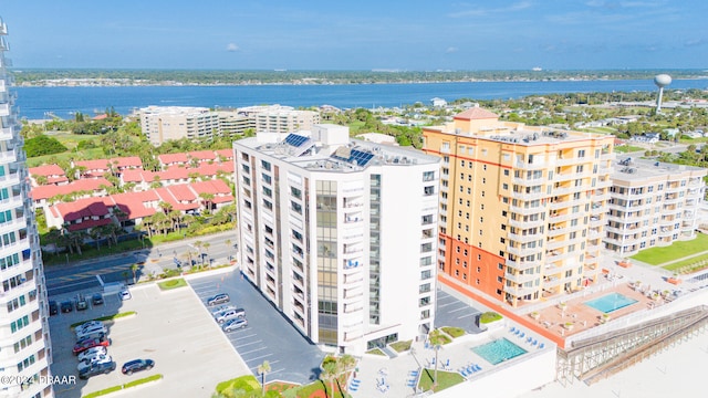 birds eye view of property with a water view