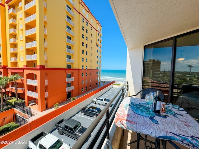 balcony featuring a water view