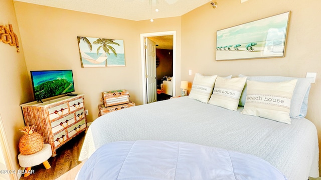 bedroom featuring hardwood / wood-style floors and ceiling fan