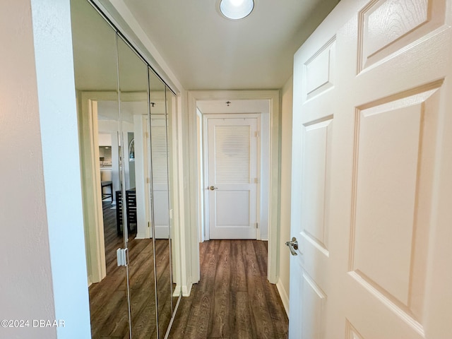 corridor with dark wood-type flooring