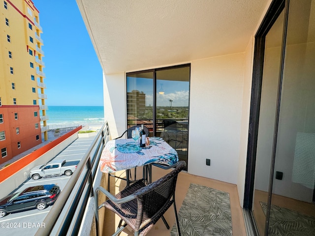 balcony featuring a water view