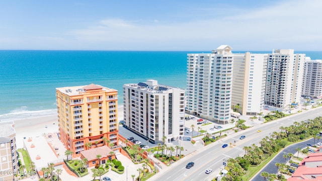 aerial view with a view of the beach and a water view