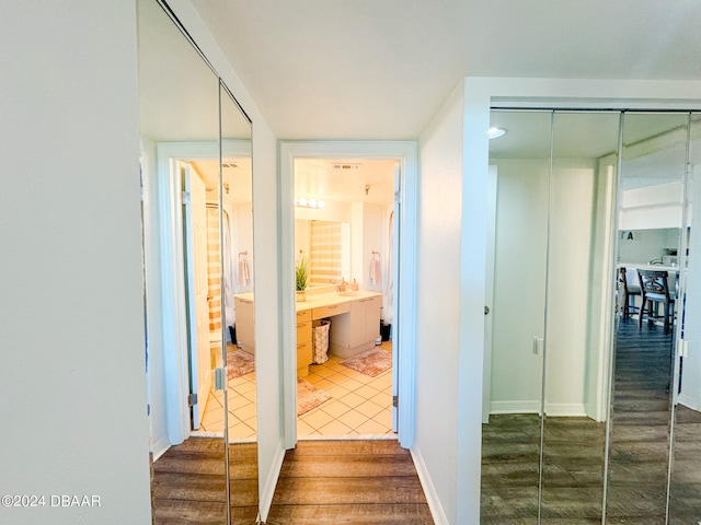 corridor with dark hardwood / wood-style floors