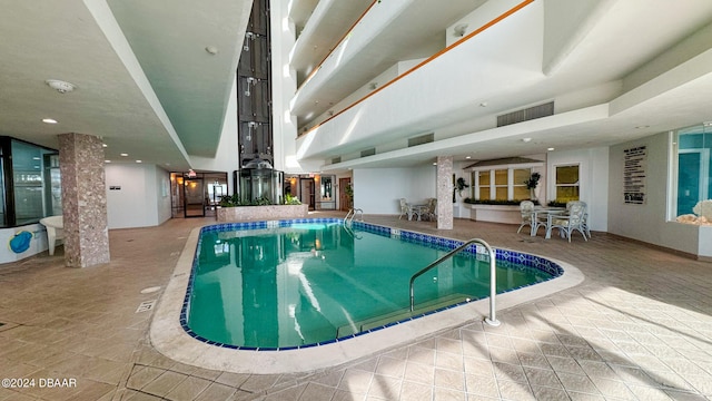 view of pool with ornate columns