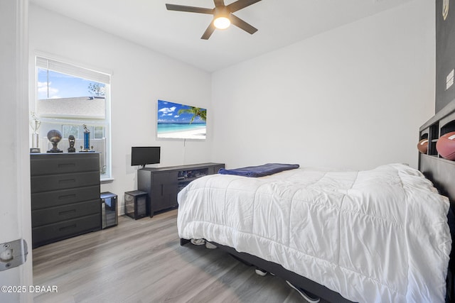 bedroom featuring ceiling fan and wood finished floors