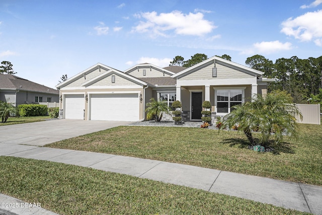 view of front of home featuring concrete driveway, an attached garage, fence, and a front yard