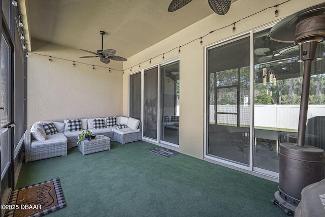 view of patio with ceiling fan and an outdoor living space