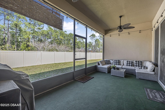 sunroom / solarium with ceiling fan