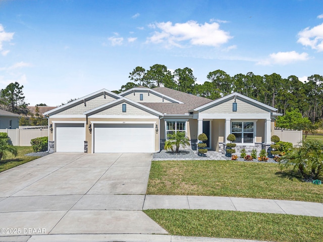 view of front of house featuring a garage, fence, concrete driveway, and a front yard