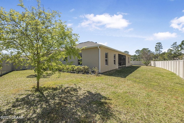 view of yard with a fenced backyard