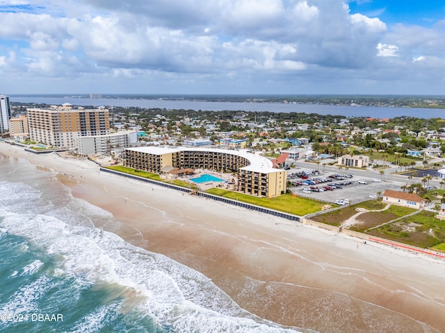 aerial view featuring a water view and a beach view