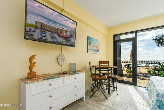 2301 S Atlantic Ave Unit 111, Daytona Beach, FL 32118 - bedroom with access to exterior and light wood finished floors