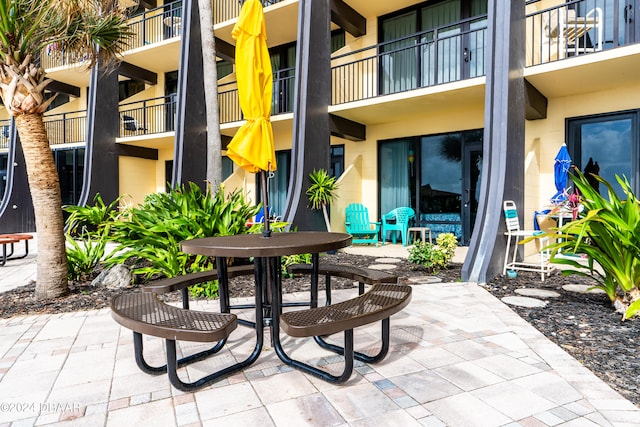 view of patio with a balcony