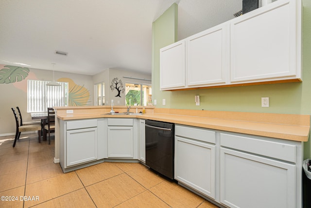 kitchen featuring dishwasher, kitchen peninsula, light tile patterned floors, sink, and white cabinetry