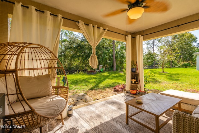 exterior space with ceiling fan