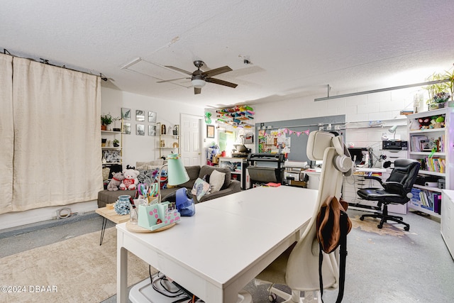 office featuring a textured ceiling and ceiling fan