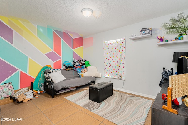 bedroom featuring a textured ceiling and tile patterned floors