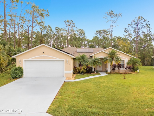 ranch-style home featuring a garage and a front lawn