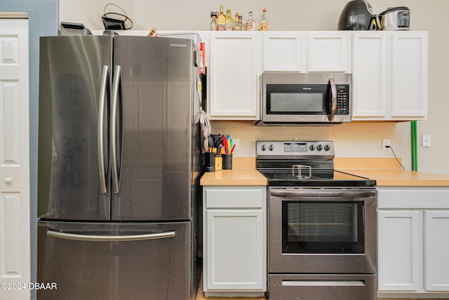 kitchen with white cabinets and stainless steel appliances