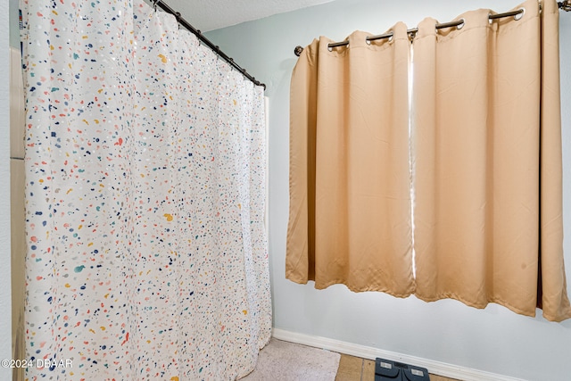 bathroom with a textured ceiling