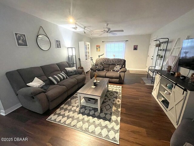 living room with ceiling fan, rail lighting, and dark hardwood / wood-style floors