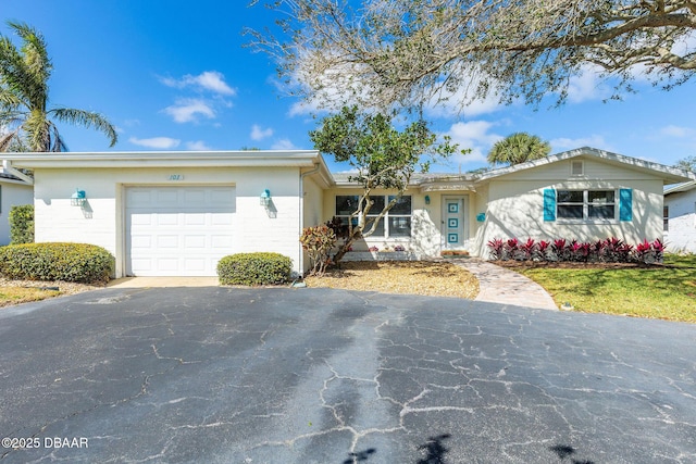 single story home featuring a garage