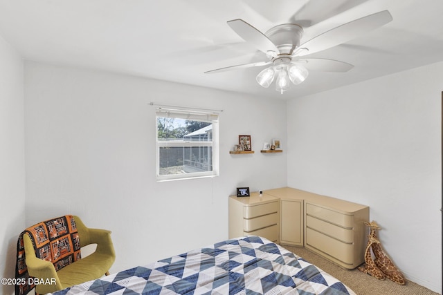 bedroom with a ceiling fan and light colored carpet