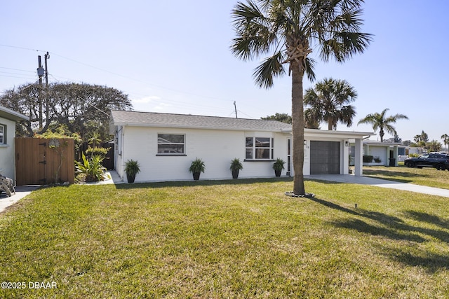 ranch-style home with a garage, concrete driveway, and a front lawn