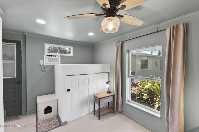 doorway to outside with ornamental molding, light wood-style floors, a wealth of natural light, and baseboards