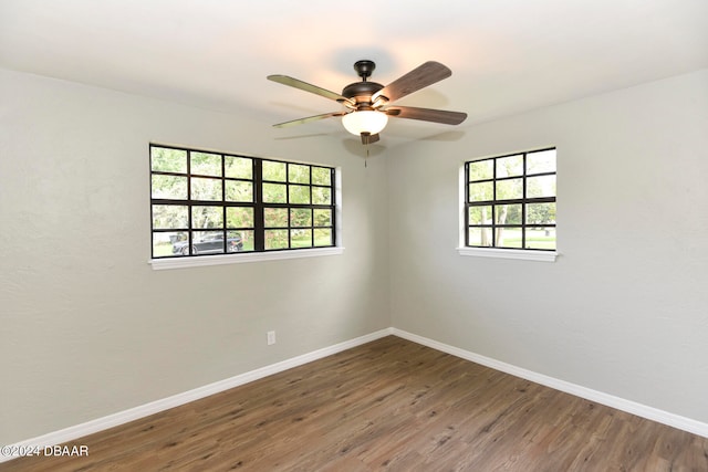 unfurnished room with wood-type flooring and ceiling fan