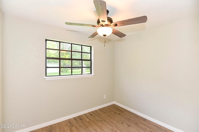 unfurnished room with hardwood / wood-style flooring and ceiling fan