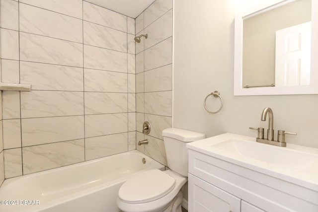 full bathroom featuring vanity, toilet, and tiled shower / bath combo