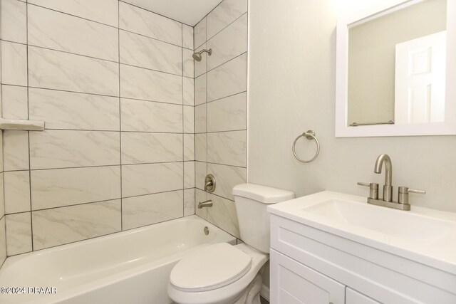 732 Orchard Ave, Ormond Beach, FL 32174 - bathroom featuring toilet, bathtub / shower combination, and vanity