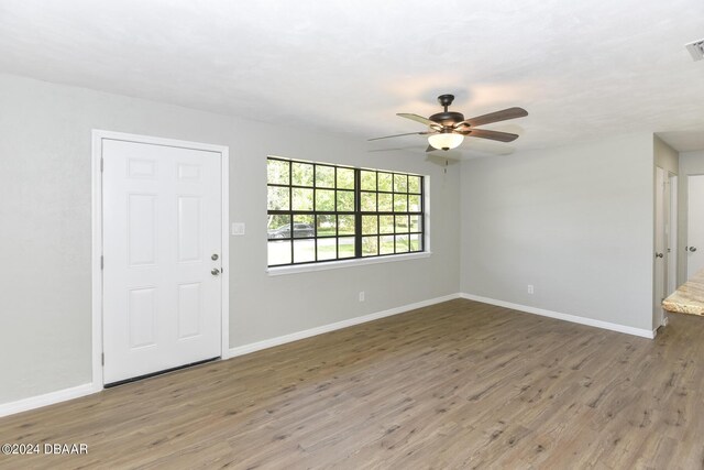 732 Orchard Ave, Ormond Beach, FL 32174 - entryway featuring ceiling fan, wood finished floors, and baseboards