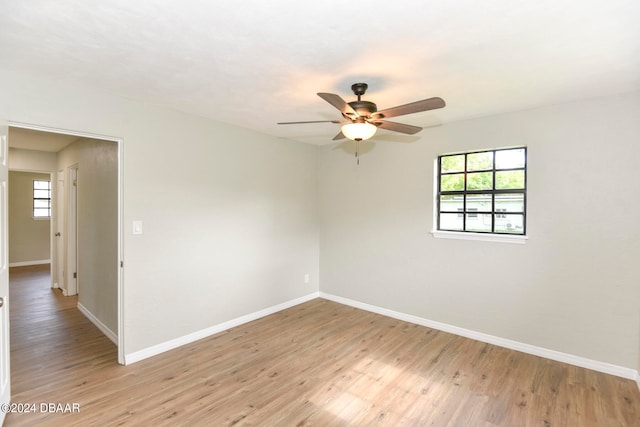 unfurnished room with ceiling fan and light hardwood / wood-style floors