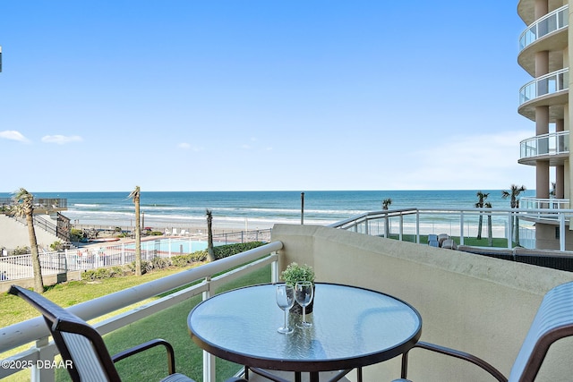 balcony featuring a water view