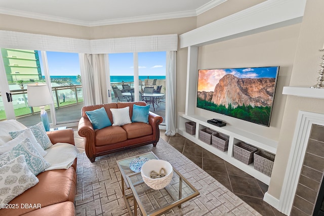 living area with ornamental molding and tile patterned floors