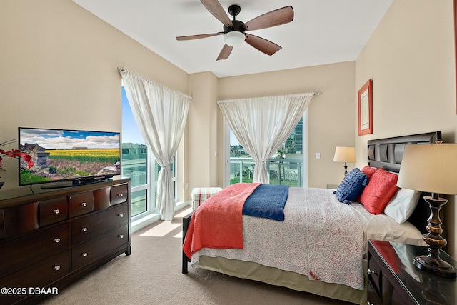 bedroom featuring ceiling fan, carpet floors, and access to outside