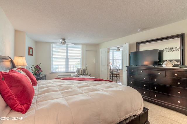 carpeted bedroom with a textured ceiling