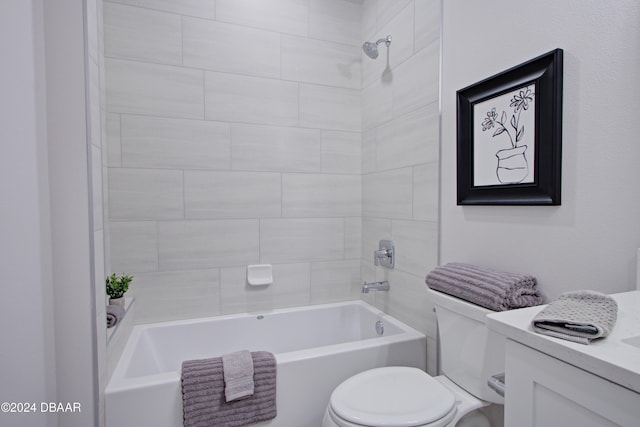 full bathroom with vanity, toilet, and tiled shower / bath