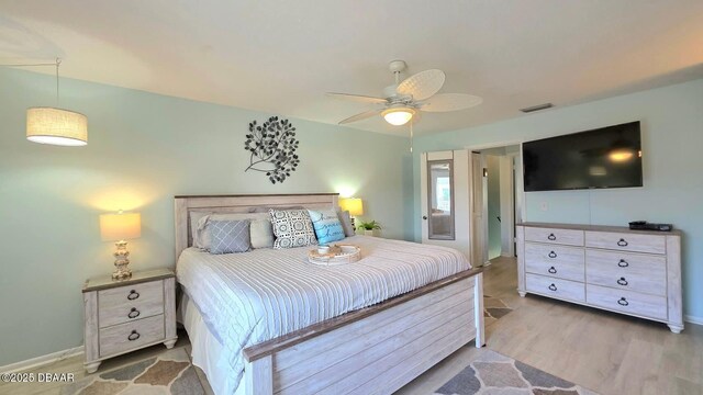 2820 Ocean Shore Blvd Unit 28, Ormond Beach, FL 32176 - bedroom featuring wood finished floors and ceiling fan