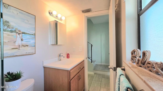 2820 Ocean Shore Blvd Unit 28, Ormond Beach, FL 32176 - bathroom featuring vanity and toilet