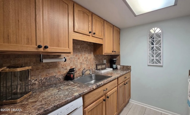 2820 Ocean Shore Blvd Unit 28, Ormond Beach, FL 32176 - kitchen featuring backsplash, dishwasher, and dark stone countertops