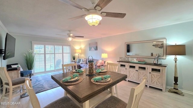 2820 Ocean Shore Blvd Unit 28, Ormond Beach, FL 32176 - dining room with a ceiling fan, light wood finished floors, and crown molding