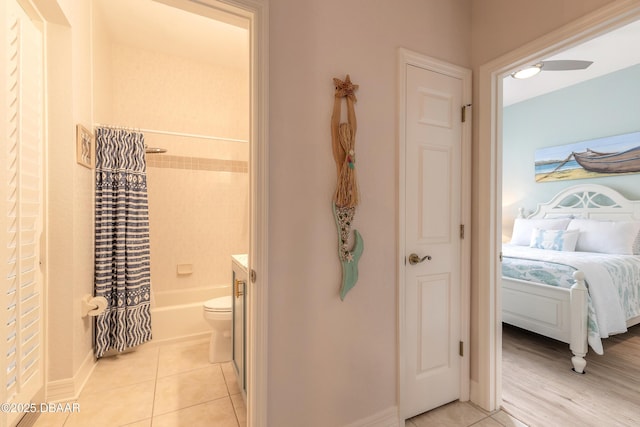 full bathroom featuring tile patterned flooring, vanity, shower / tub combo, and toilet