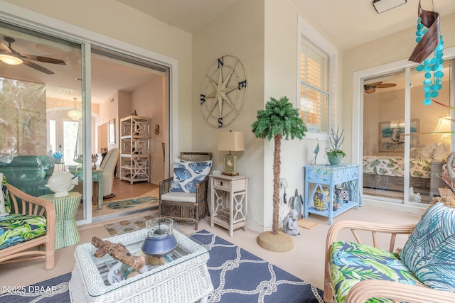 living area featuring ceiling fan