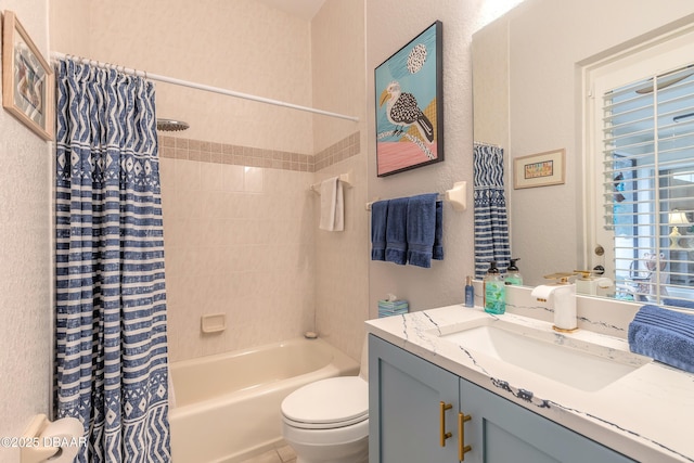 full bathroom with vanity, shower / bathtub combination with curtain, and toilet