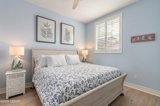 bedroom featuring ceiling fan and light hardwood / wood-style floors